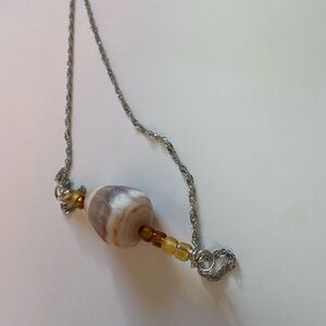 Handcrafted adjustable silver cone shell necklace with brown beads